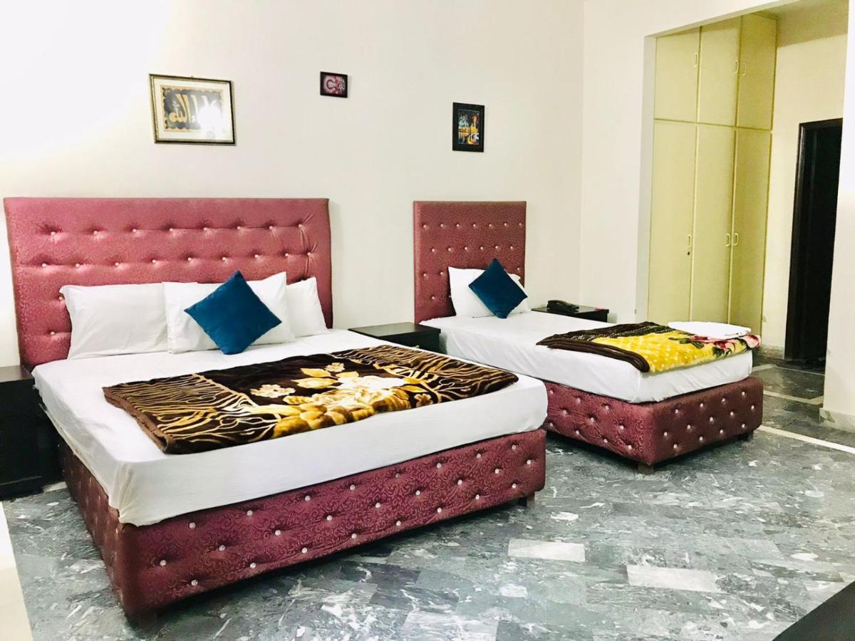 Hotel Rose Inn ลาฮอร์ ภายนอก รูปภาพ