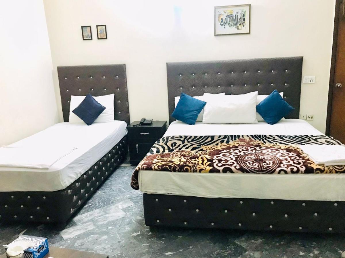 Hotel Rose Inn ลาฮอร์ ภายนอก รูปภาพ